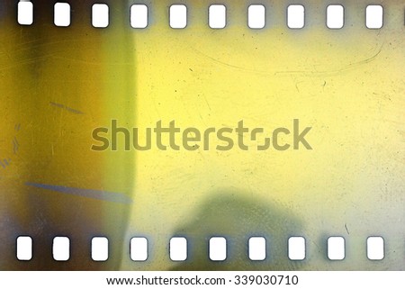 Blank yellow vibrant noisy film strip texture background