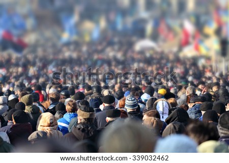 Crowd of anonymous people on street in city center, selective focus Royalty-Free Stock Photo #339032462
