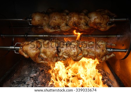 Rotisserie Chicken on Spit over Flames