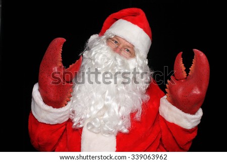Santa Claus wears Lobster Claw Hands while posing in a PHOTO BOOTH for a funny picture.