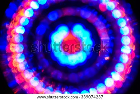 Abstract fractal multicolored background with crossing circles and ovals. disco lights background.