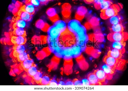 Abstract fractal multicolored background with crossing circles and ovals. disco lights background.
