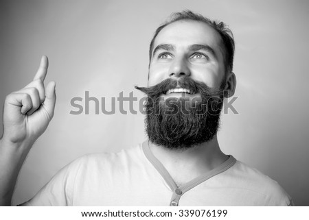 emotional and people concept: young bearded man with good idea sign. Hipster style.