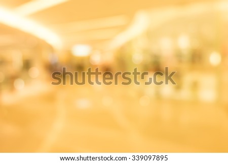 blurred image of shopping mall and people with vintage tone for background usage .
