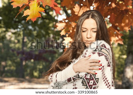 young girl in autumn outdoors