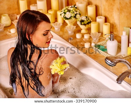 Young woman enjoing in hot bath.