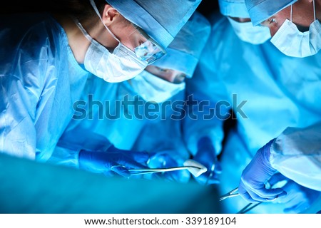 Young surgery team in the operating room Royalty-Free Stock Photo #339189104