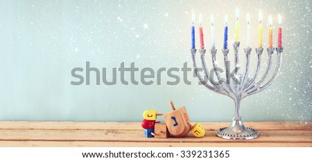 website banner image of of jewish holiday Hanukkah with menorah (traditional Candelabra). retro filtered