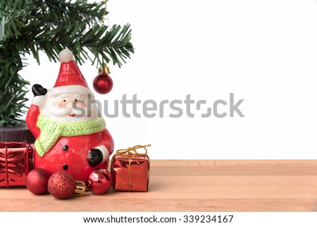 Santa claus with the gift and christmas tree, this is season greeting for joyful and happiness, santa claus is coming in town, merry christmas
