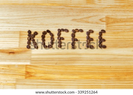 the inscription of the coffee beans on a wooden board.