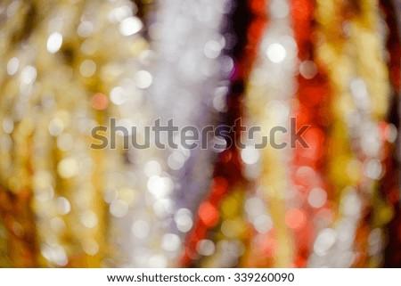 Picture of beautiful blurred background with red, yellow, green and white bokeh. Artistic effect background for festive decor.