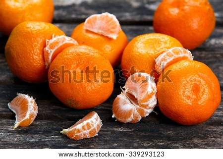 Fresh Close up Tangerines on old wooden table