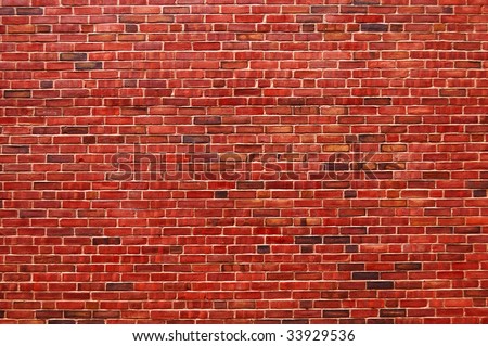 Old wall of red briks tiled background, regular block texture. Old wall of red briks. Red brick wall. Wallpaper of ordinary building wall texture. Tiles. Background of brick wall texture. Royalty-Free Stock Photo #33929536