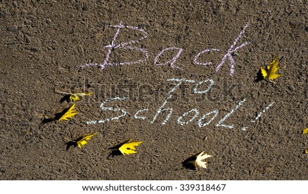 back to school written with chalk on asphalt