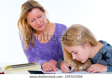girl learning together with teacher in the classroom
