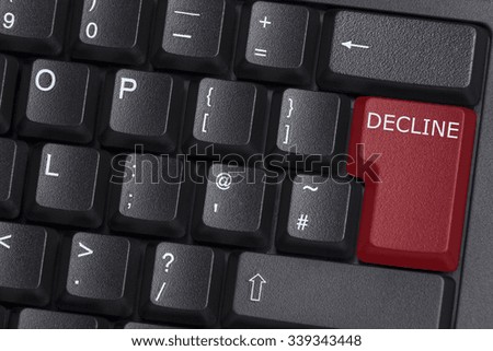 A red DECLINE button on computer keyboard