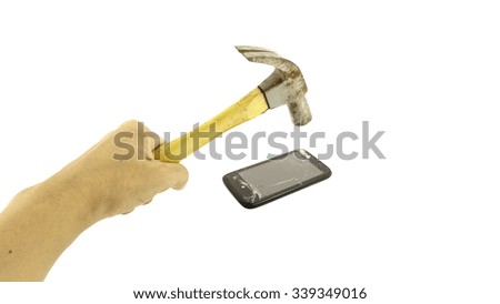 Hand holding hammer and smartphone with a broken screen over the white background.