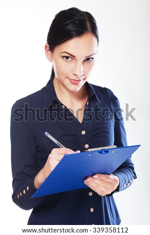 Business woman write on clipboard looking and hearing you