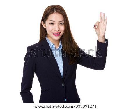 Asian Businesswoman showing ok sign gesture