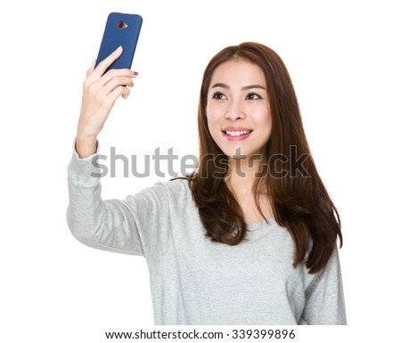 Asian Young Woman take the selfie