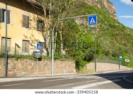 Road sign pedestrian crossing point on a dangerous street
