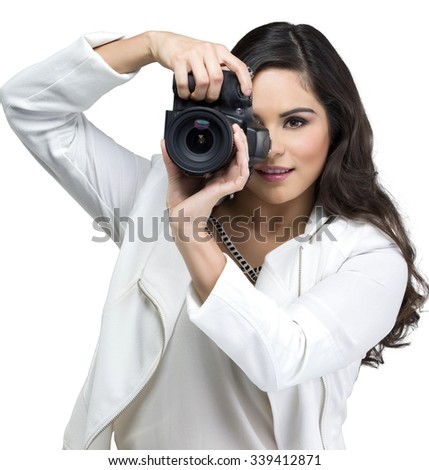 Serious Caucasian young woman with long black hair in casual outfit using camera - Isolated
