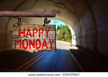 Happy monday motivational phrase sign on old wood with blurred background