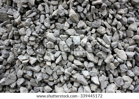 Gray gravel for laying of asphalt roads and filling of emptiness Royalty-Free Stock Photo #339445172