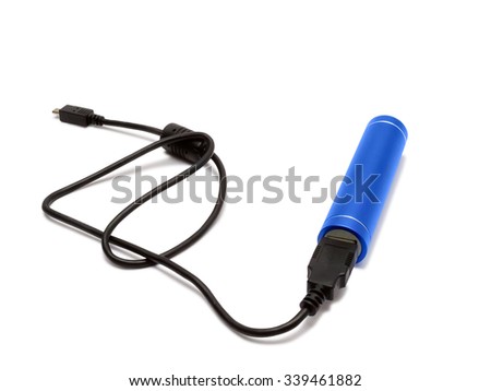 External battery or power bank in a blue metal cylinder with USB cable over white.