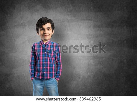 Funny young bigheaded man in casual with hands in pockets