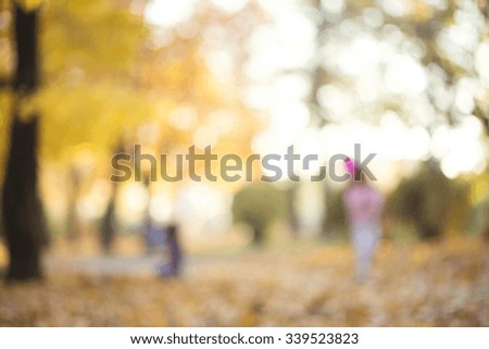 Autumn or fall abstract nature background, intentional blur background of autumnal trees and leaves in park