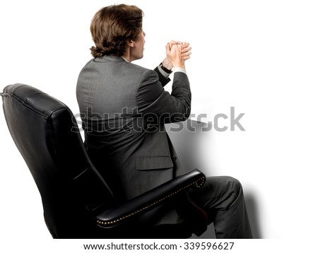 Serious Caucasian man with short dark brown hair in business formal outfit with clasped hands - Isolated