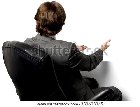 Caucasian man with short dark brown hair in business formal outfit pointing using palm - Isolated