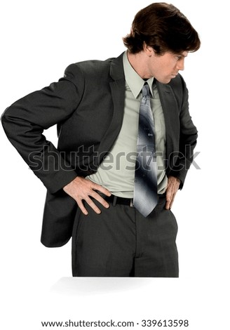 Serious Caucasian man with short dark brown hair in business formal outfit with hands on hips - Isolated