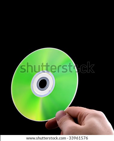 abstract cd dvd blue-ray disk in hand isolated on black