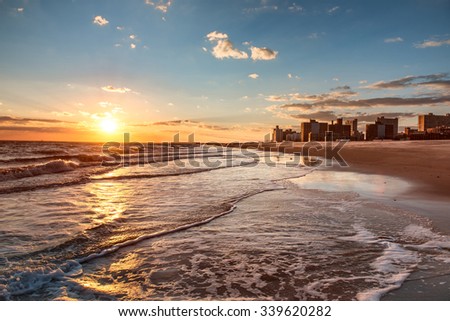 Sunset on Brighton Beach in Brooklyn, New York City Royalty-Free Stock Photo #339620282