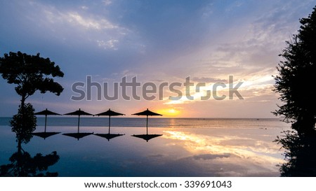 sunrise and swimming pool reflection.