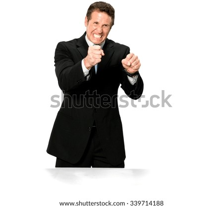 Angry Caucasian man with short medium blond hair in business formal outfit shaking fist - Isolated