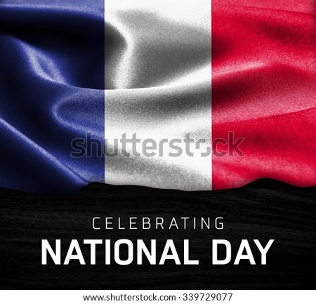 France flag and Celebrating National Day Typography on wood background