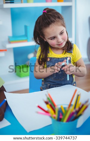 Happy kids enjoying arts and crafts together in the bedroom