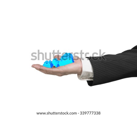 Human hand holding blue plastic stack blocks, isolated on white background.