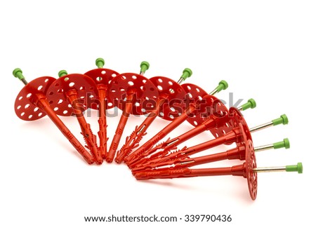 Dowels - dubel , Red plastic dowel isolated on white background.Close up.