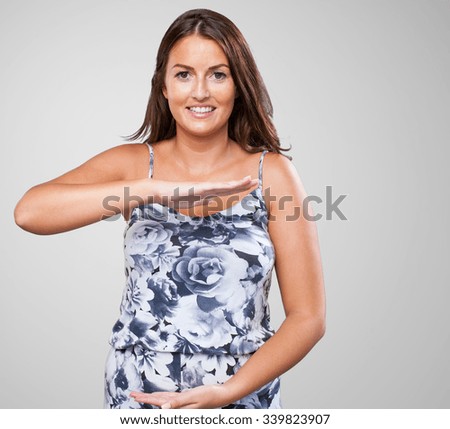 pretty woman holding something gesture