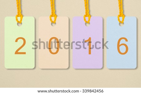 Happy New Year 2016, running number tags in pastel tone with drawing paper background.