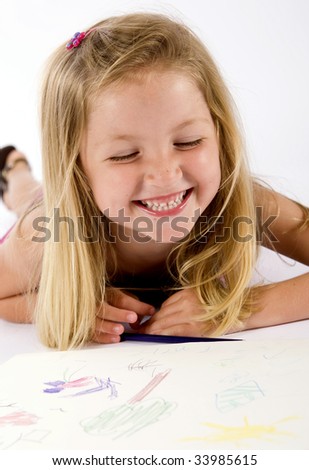 Little girl drawing on paper