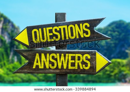 Questions Answers signpost in a beach background Royalty-Free Stock Photo #339884894