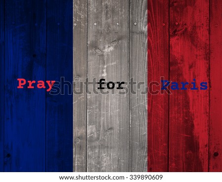 French flag on grunge Wood wall background. Pray for Paris.