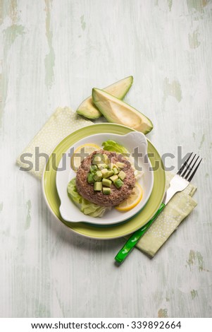 healthy hamburger with avocado and lettuce salad