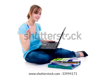 Teenager schoolgirl with laptop on white background