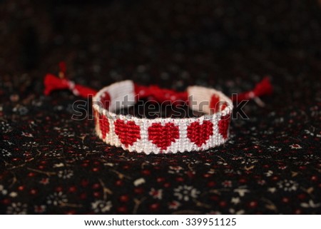 Fenichka "9 Hearts" made by direct hand weaving with the image of 9 red hearts on a white background. Handmade.